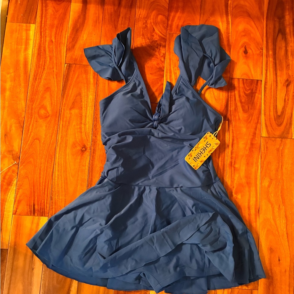 Shekini swim dress new with tags
Blue size S